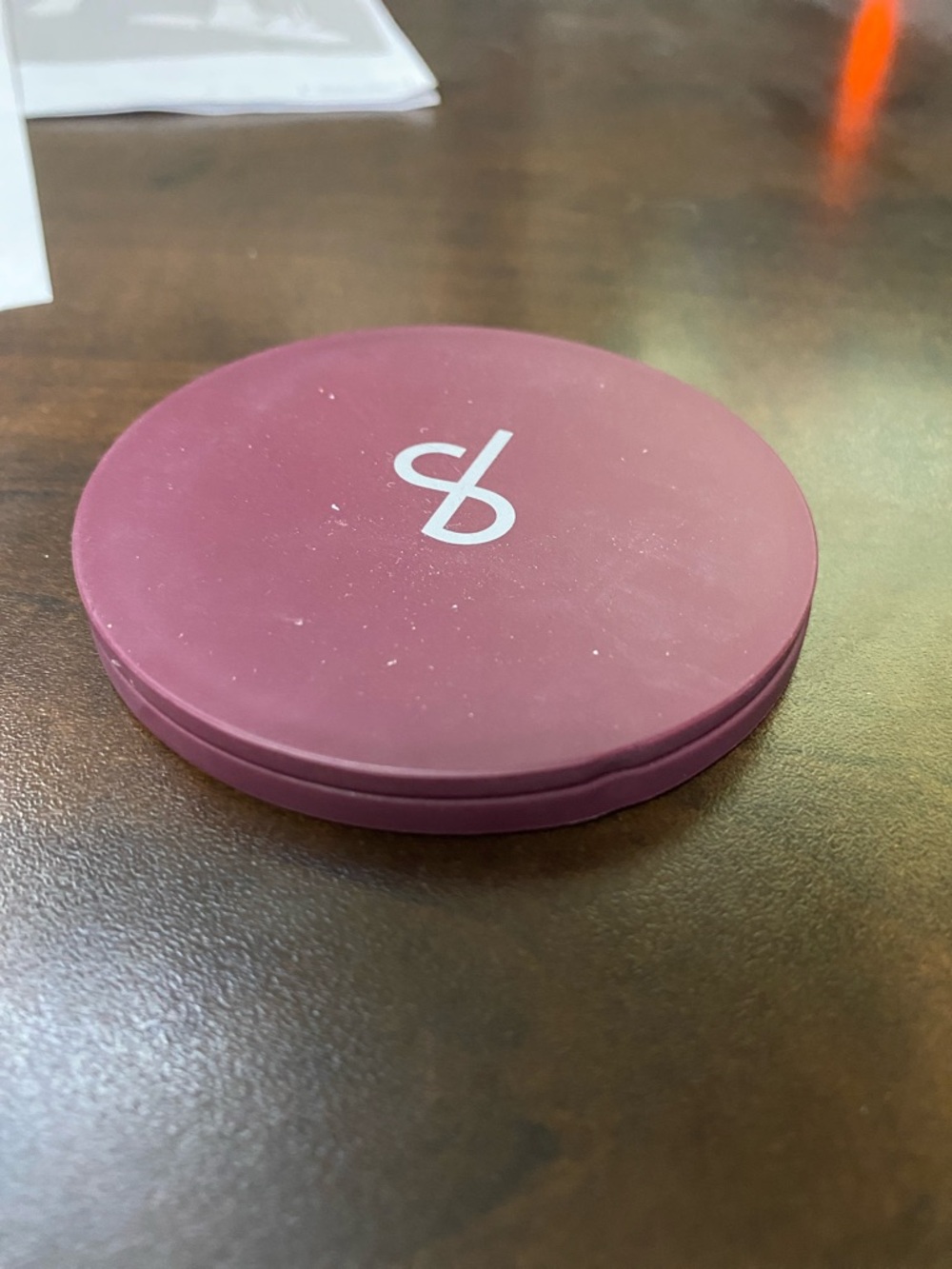 Round Plum Compact with Subtl Beauty Logo